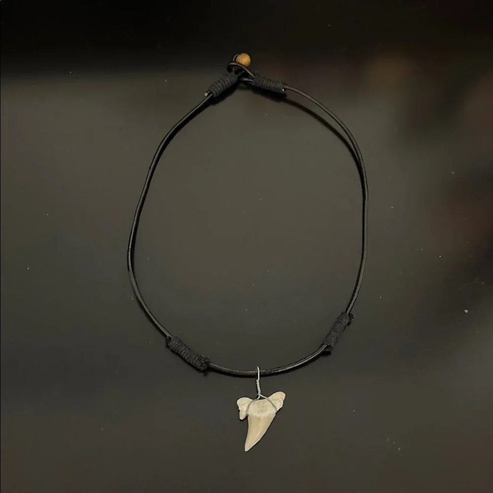 Three shark tooth necklaces